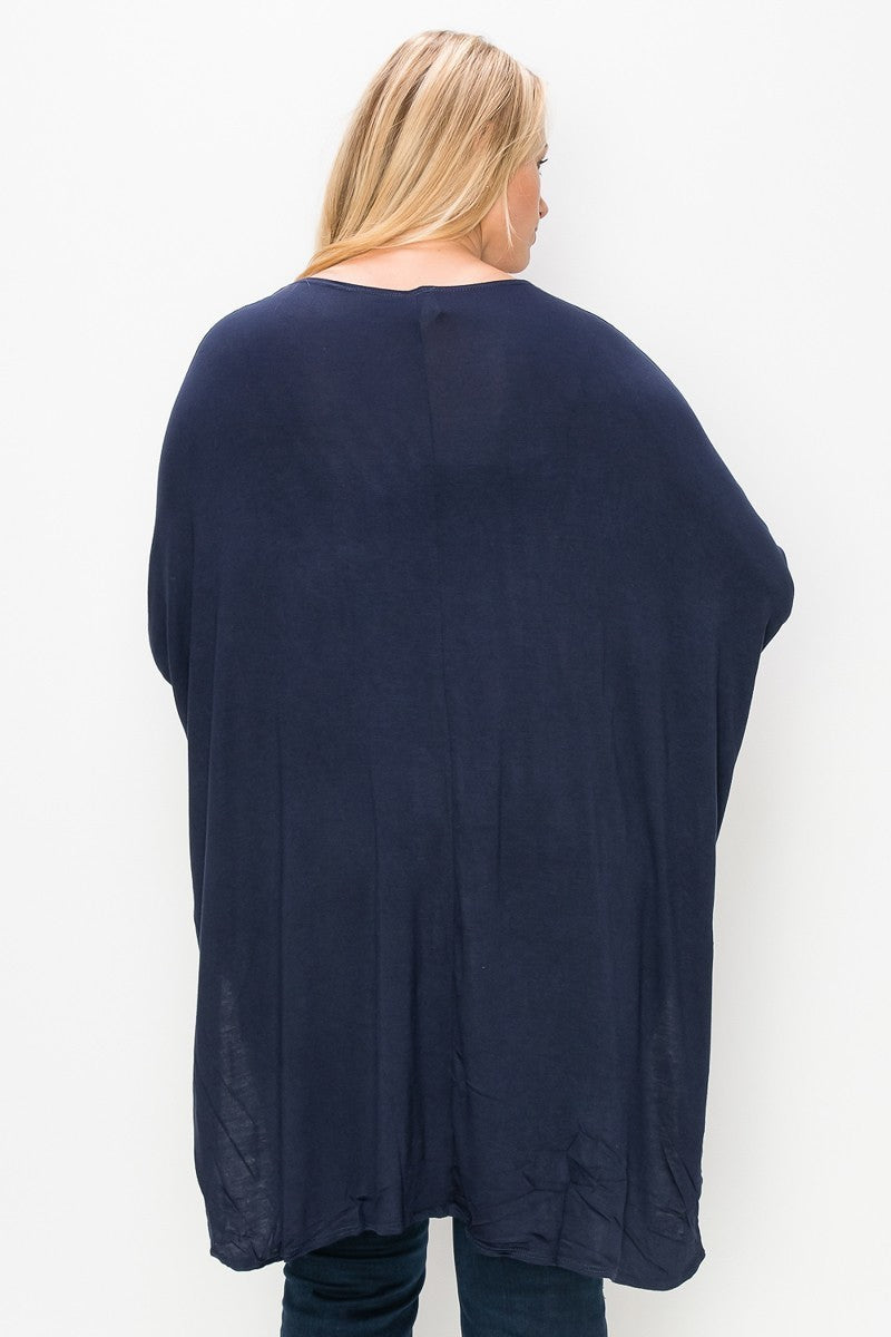 Solid top featuring a round neck, three quarter sleeves, and a high-low hem